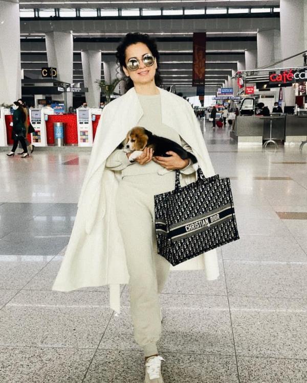 Anushka Sharma completes her Airport look with Christian Dior Bag