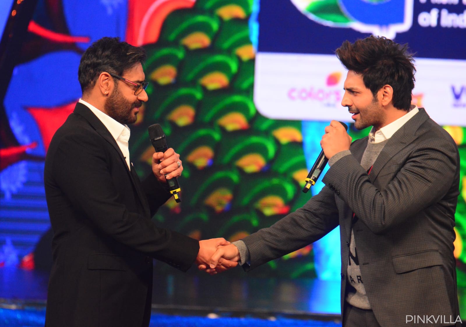 Bollywood actors Kartik Aaryan, Ajay Devgn shake hands and greet each other with warmth and positivity. 