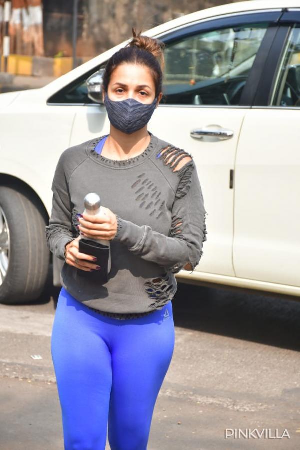Malaika Arora looks hot in a black sports bra, sunglasses as she goes for  yoga