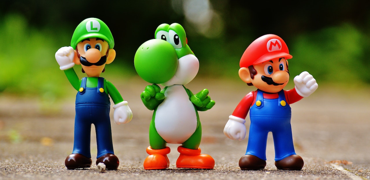 Photo of Super Mario, Luigi, and Yoshi Figurines