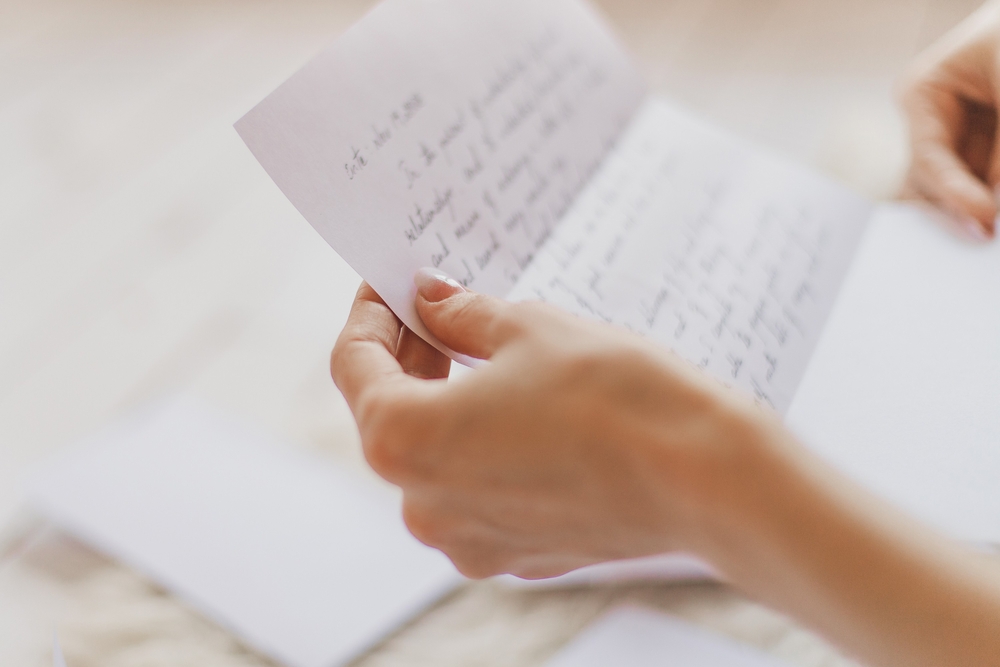  A wife reading her apology letter to her husband