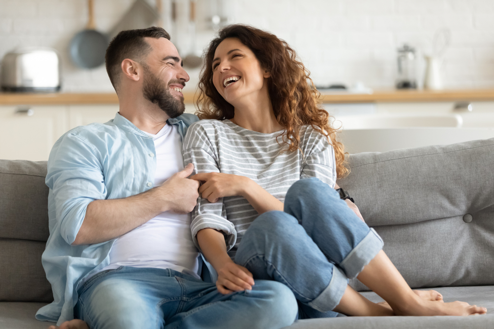 A wife with  her happy husband after writing an apology letter