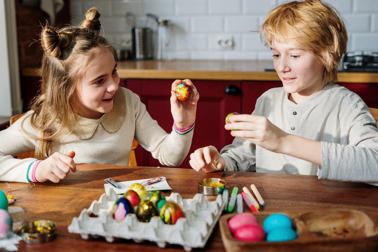 A brother and sister together painting easter eggs calling  Cute and Adorable Nicknames for Brother