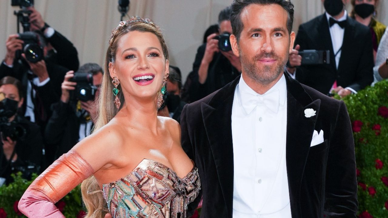 Blake Lively nearly SPILLS out of her top while jumping up and