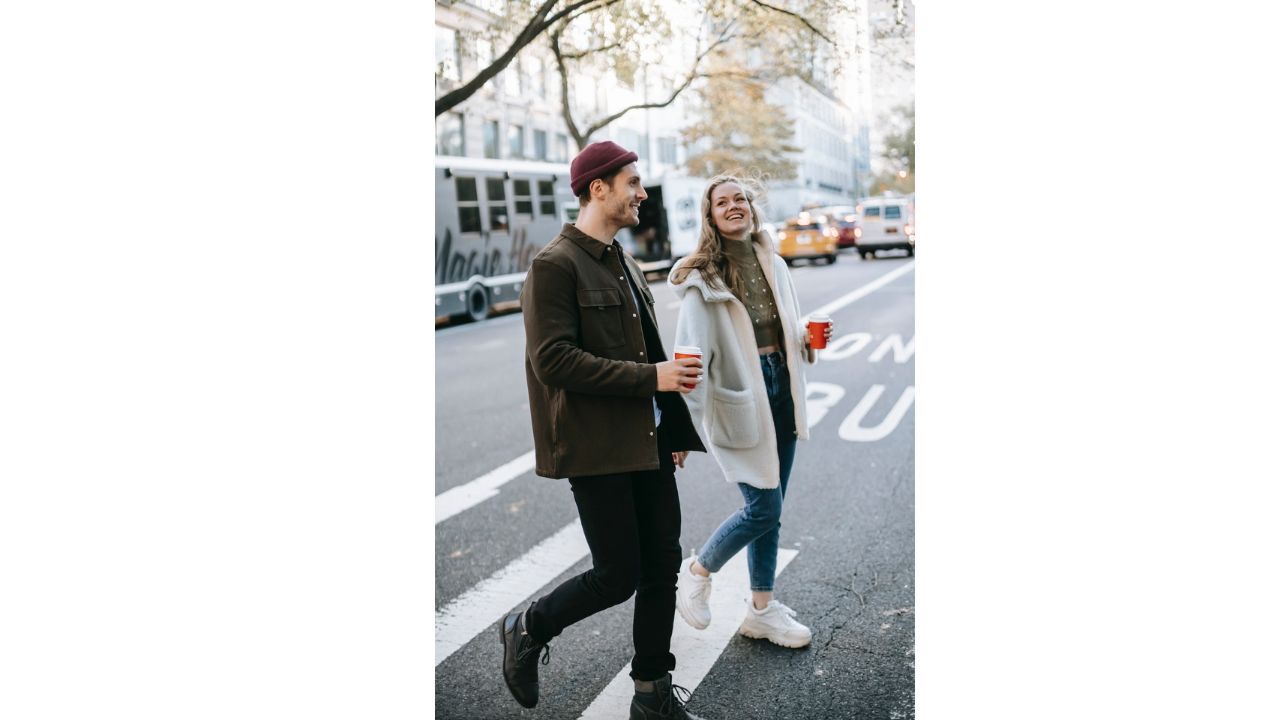 A romantic and cute thing you can do for your boyfriend is be a couple walking on street with coffee cups