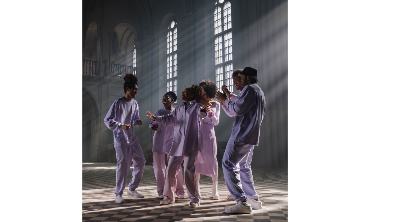 Group of People in Lilac Uniform Doing Church Service