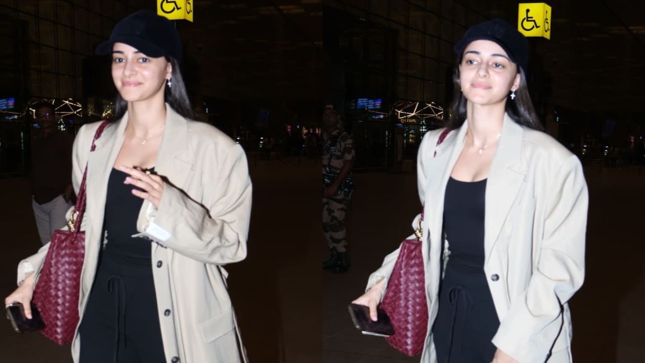  Ananya Panday gives her airport look a trendy spin by layering trench coat over black top and joggers 