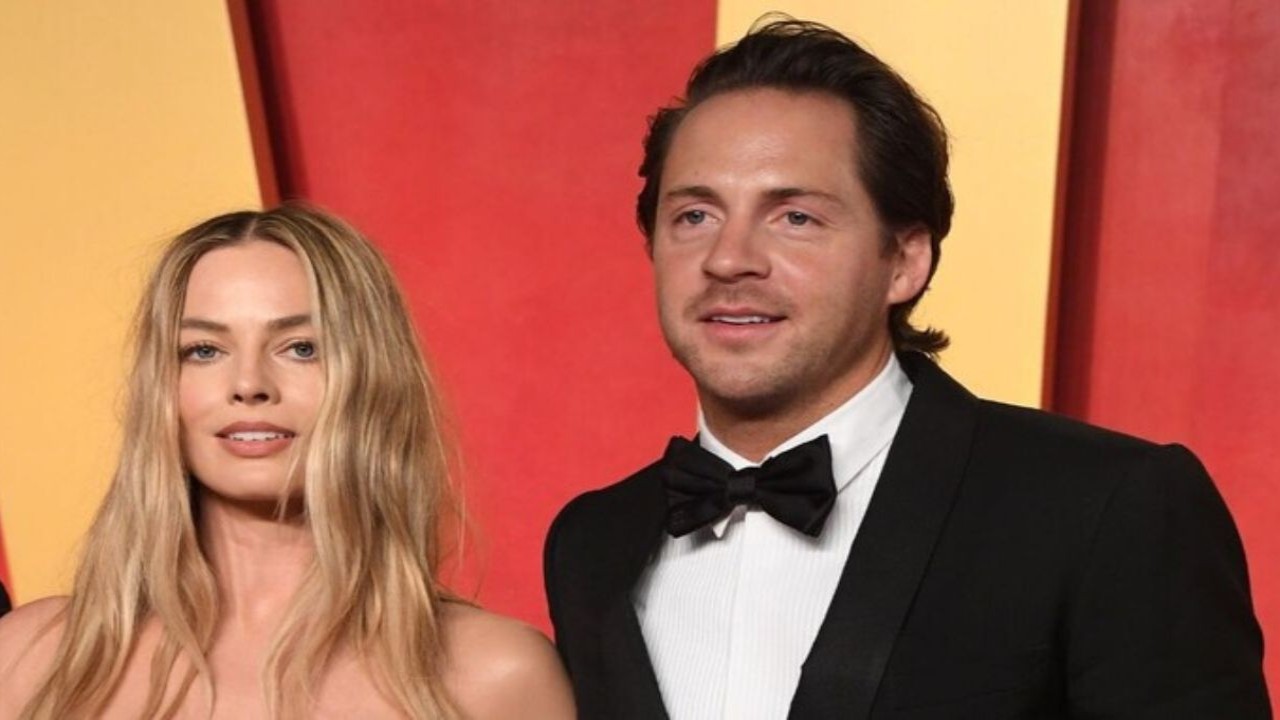 Margot Robbie and Tom Ackerley (CC: Getty Images)