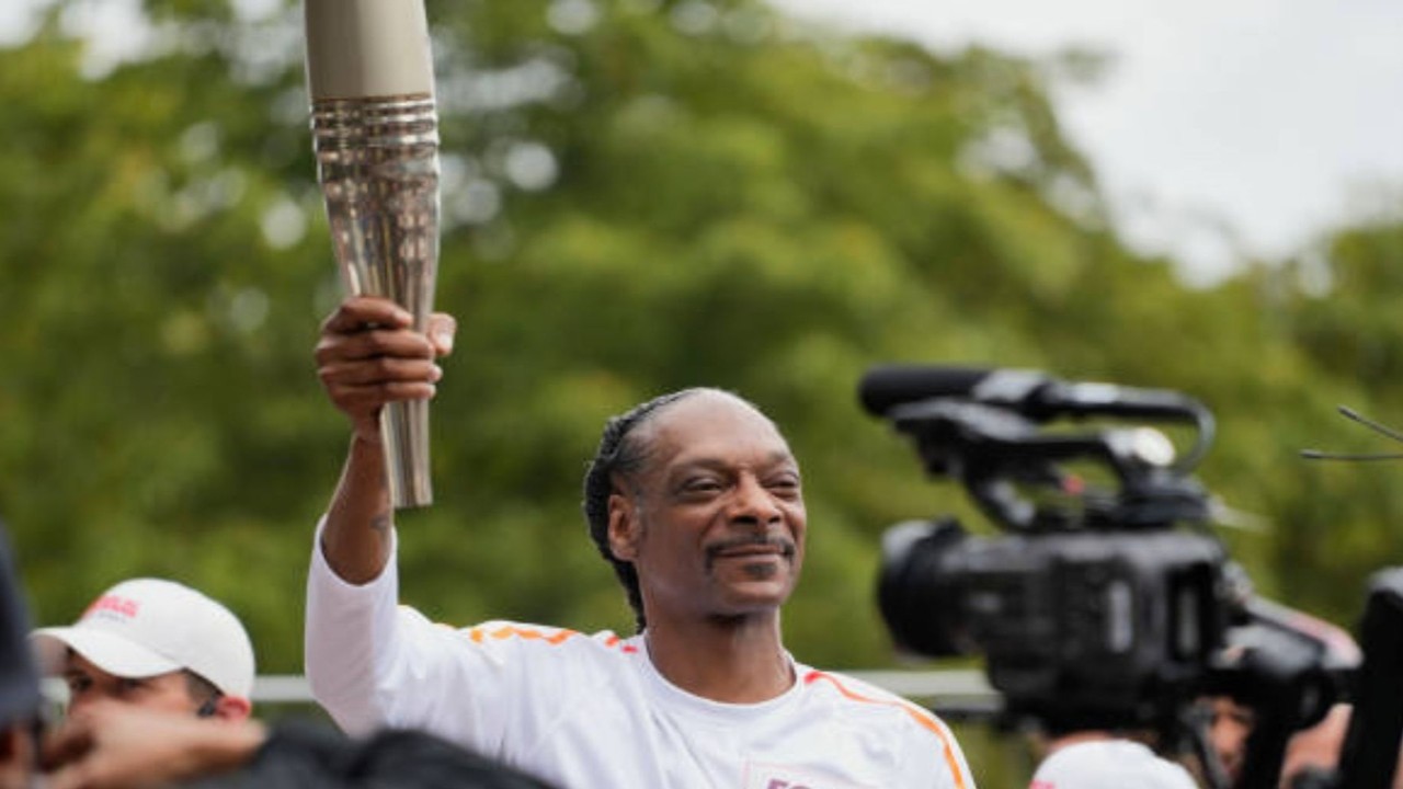 Watch: Snoop Dogg Dances the Olympic Torch Through Paris Suburb Ahead of Opening Ceremony and Fans Love It