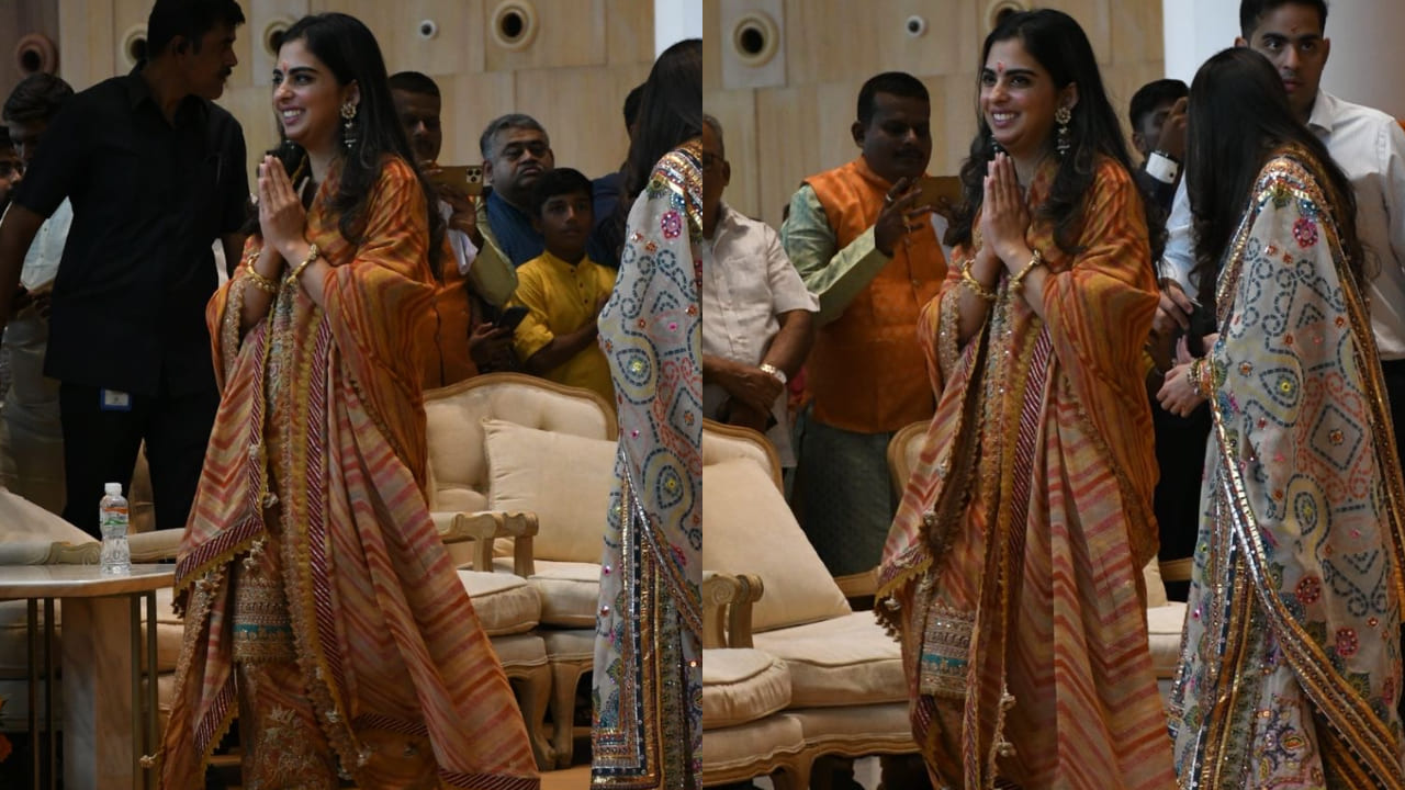 Isha Ambani in orange suit 