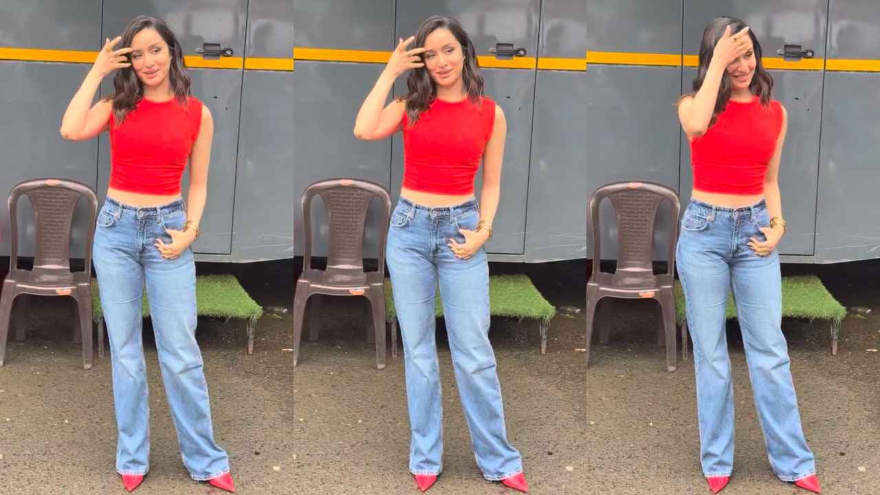 Shraddha Kapoor pairs sleeveless red crop top and wide-legged jeans with pumps for a radiant look (PC: Pinkvilla)