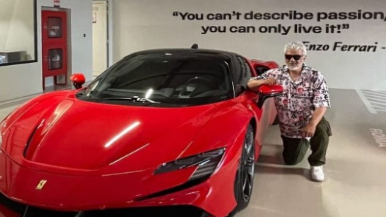 Ajith Kumar poses beside his latest purchase a swanky red Ferrari worth Rs 9 crores