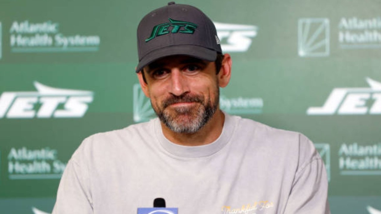 NFL QB Aaron Rodgers admits regret over 2021 'immunized' comment in new biography, offering insights into his vaccination stance.