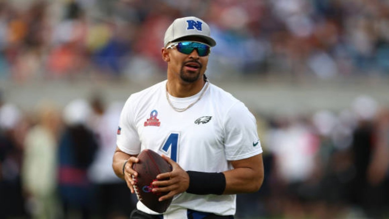 NFL star Jalen Hurts lights LA Coliseum torch, heralding flag football's Olympic debut in 2028.