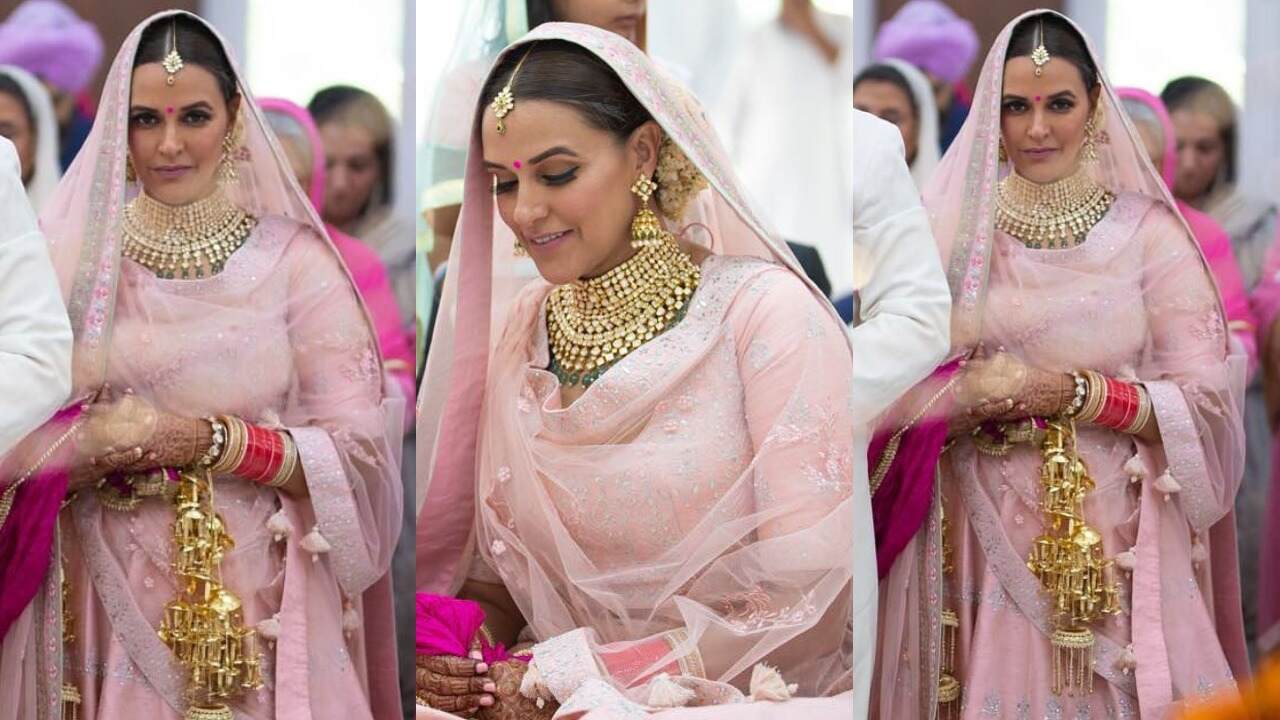 Neha Dhupia’s powder pink silk bridal lehenga by Anita Dongre (PC: nehadhupia Instagram)