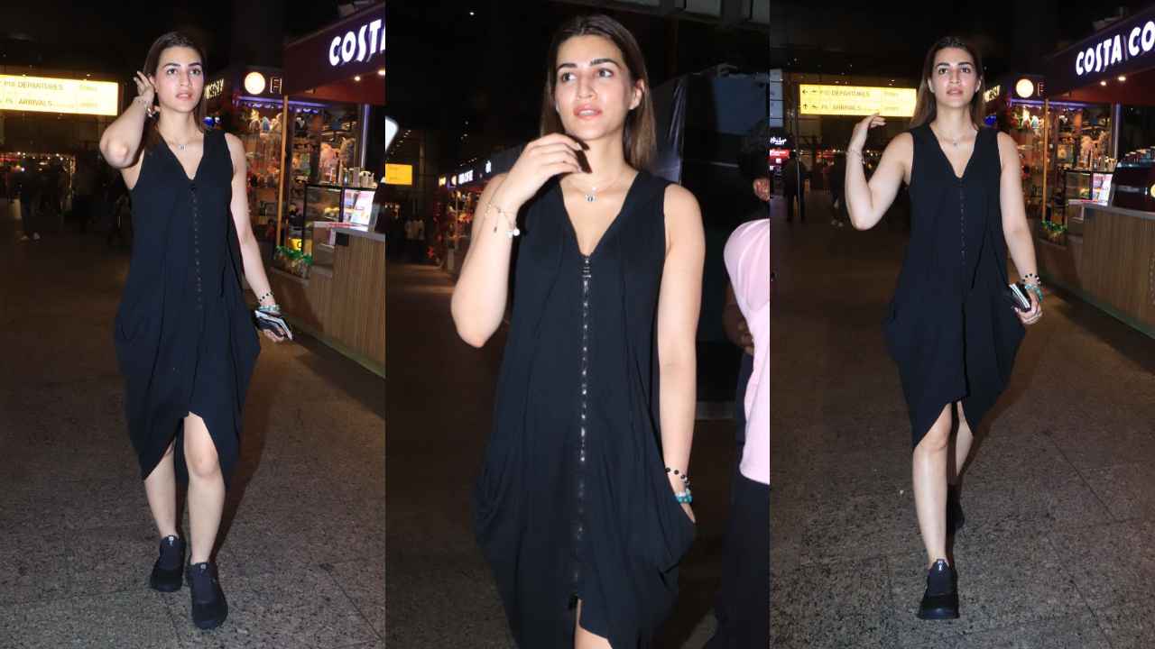 Kriti Sanon’s baggy black hooded zip dress is the perfect travel-ready choice for modern fashionistas (PC: Viral Bhayani, Varinder Chawla)