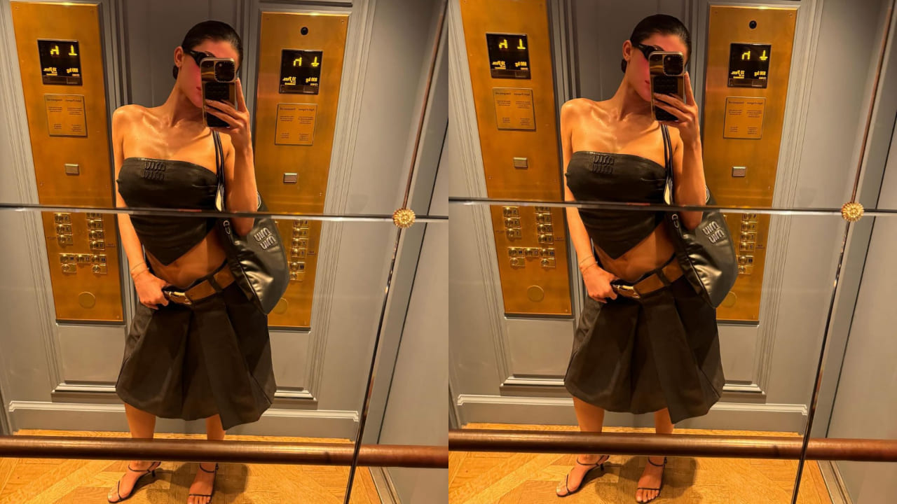 Kylie Jenner in Miu Miu scarf top and pleated skirt