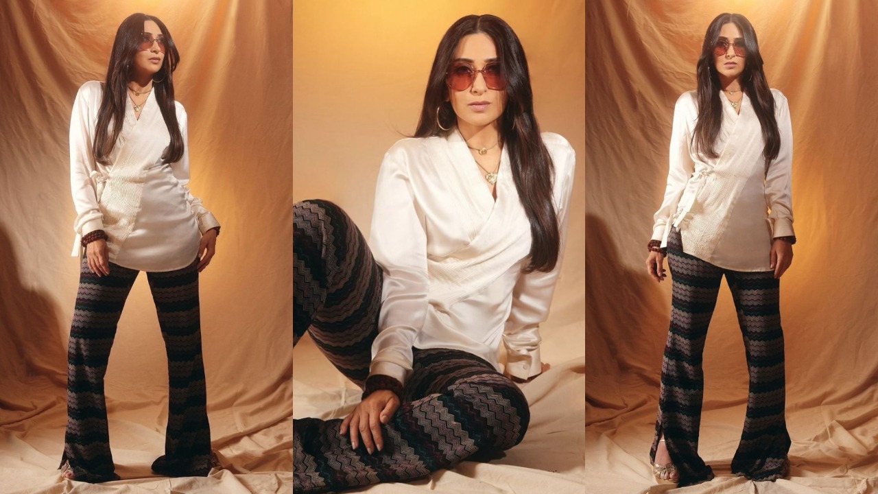 Karisma Kapoor in long white top with abstract pants  (PC: Karisma Kapoor's Instagram)