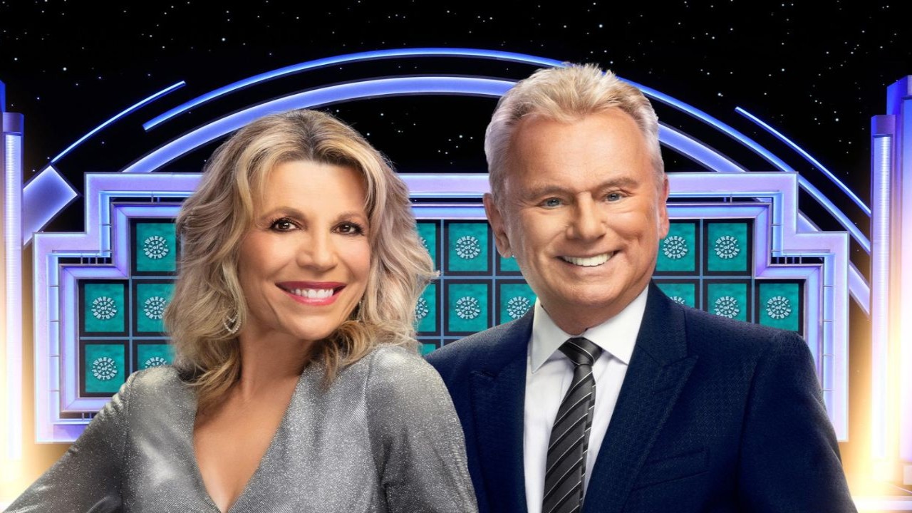 Hosts Vanna White and Pat Sajak (CC: official poster of Wheel of Fortune from IMDb)