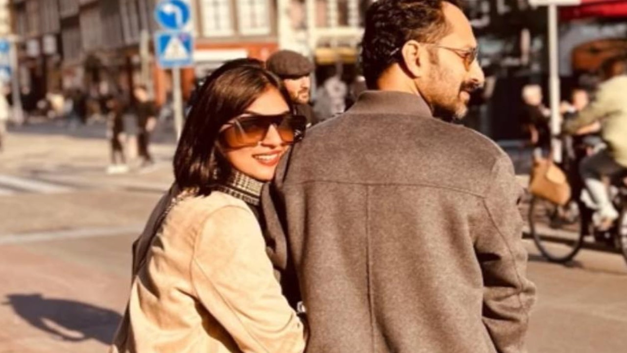 Fahadh Faasil and his wife Nazriya Nazim pose for a romantic sunkissed PHOTO on the streets of Paris