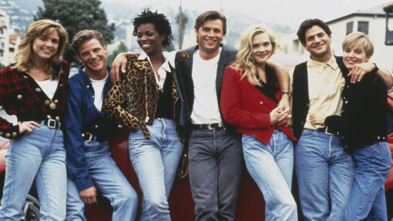 from left to right: Courtney Thorne-Smith, Doug Savant, Vanessa Williams, Grant Show, Amy Locane, Thomas Calabro and Josie Bissett (CC: Getty Images)