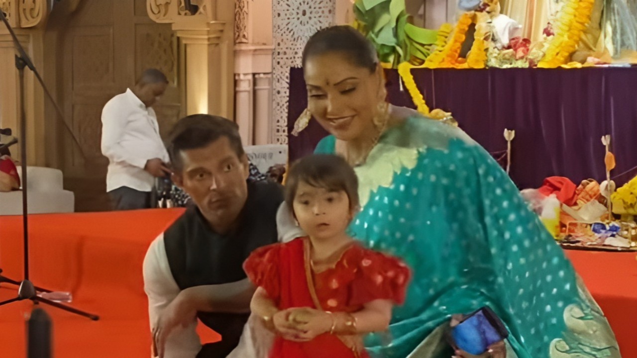 Bipasha and Karan's daughter Devi wins over paps with her cute antics at Durga Puja; WATCH