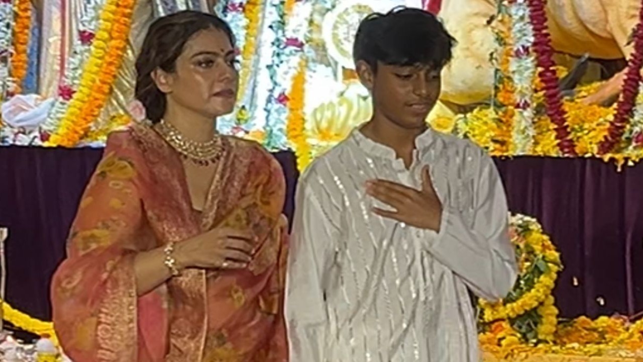 Mommy Kajol holds son Yug by his arm as they seek blessings of Maa Durga at pandal; netizens go gaga: WATCH