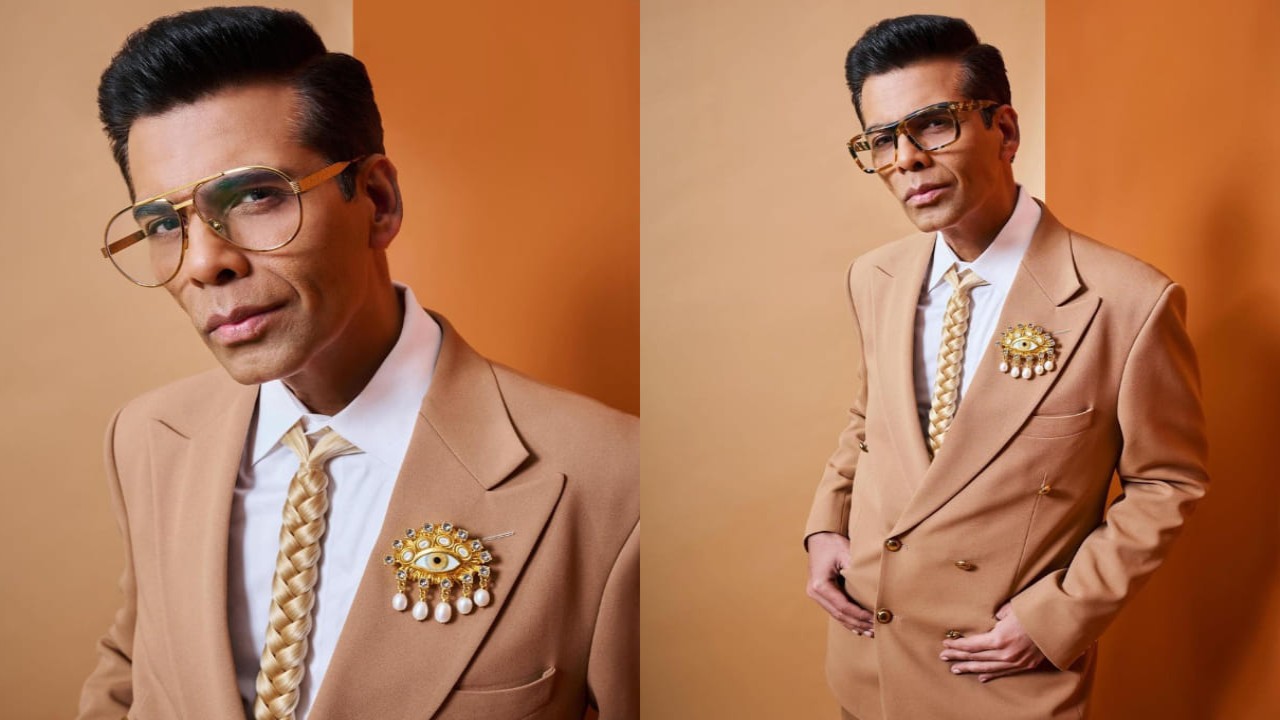 Karan Johar in brown suit and accessories