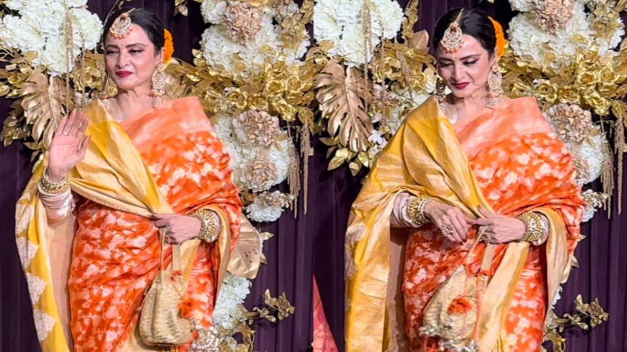 Rekha is a festive dream in orange Kanjeevaram saree and genda phool in her bun