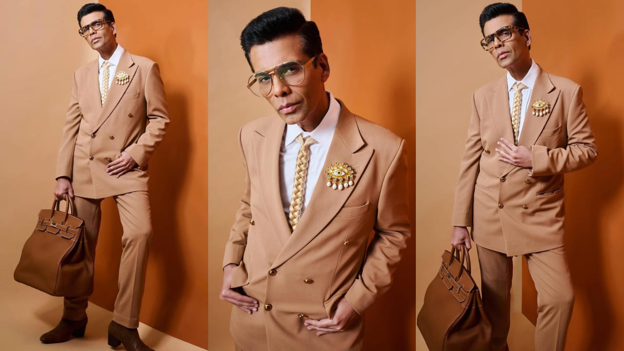 Karan Johar in brown suit and accessories