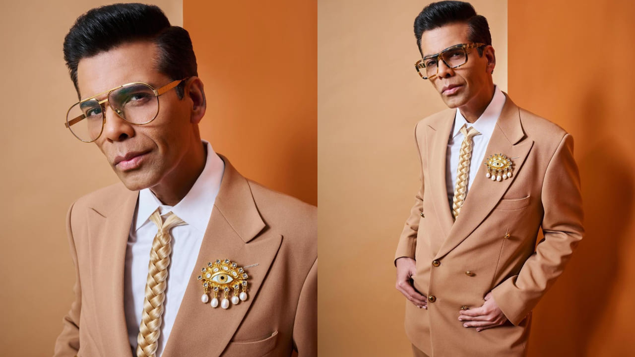 Karan Johar in brown suit and accessories