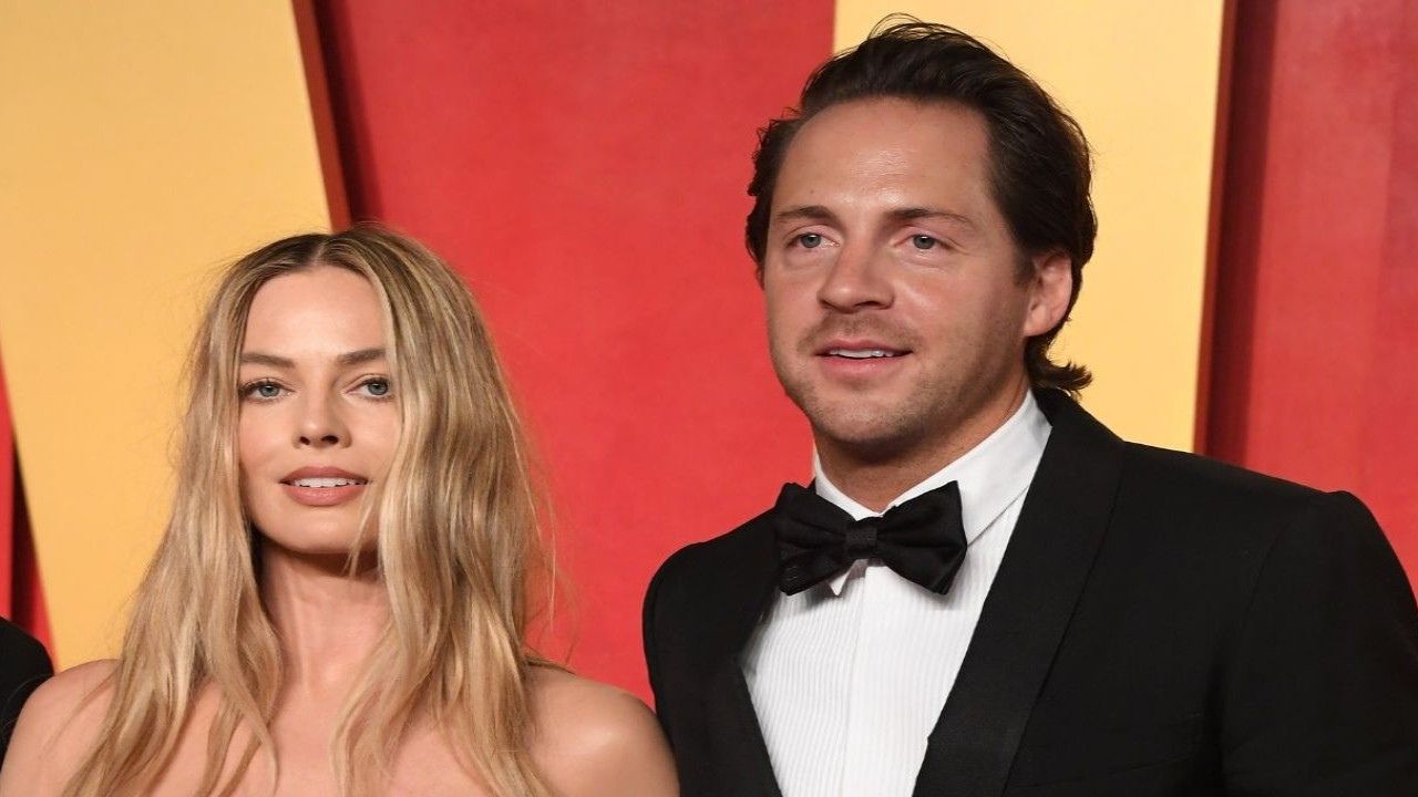 Margot Robbie and Tom Ackerley (via Getty Images)