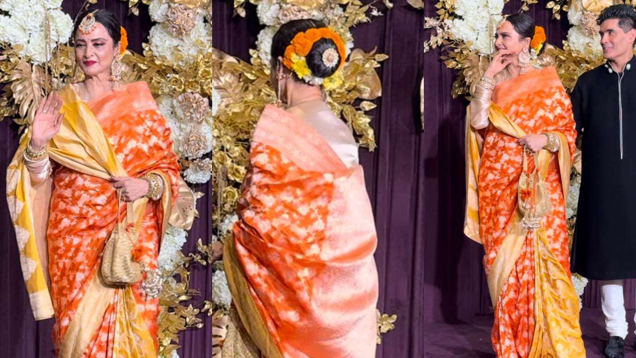 Rekha is a festive dream in orange Kanjeevaram saree and genda phool in her bun