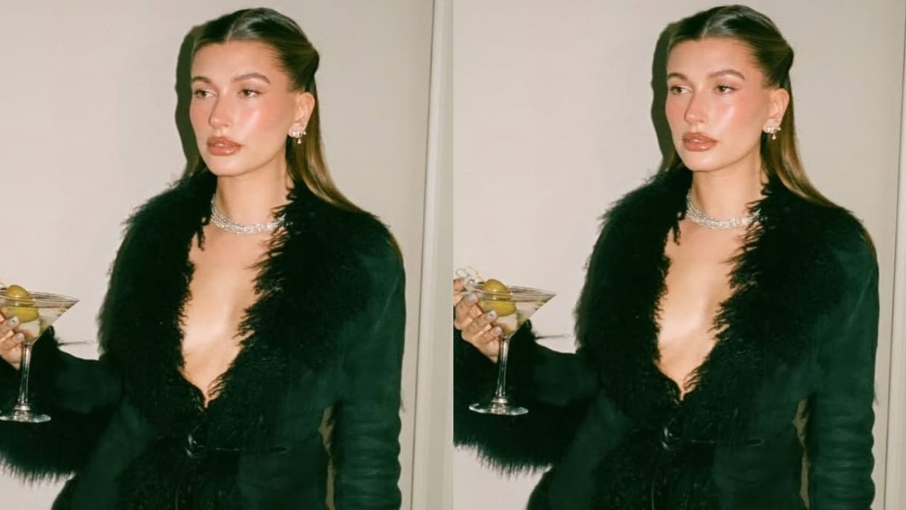 Hailey Bieber serving holiday party glam in black outfit