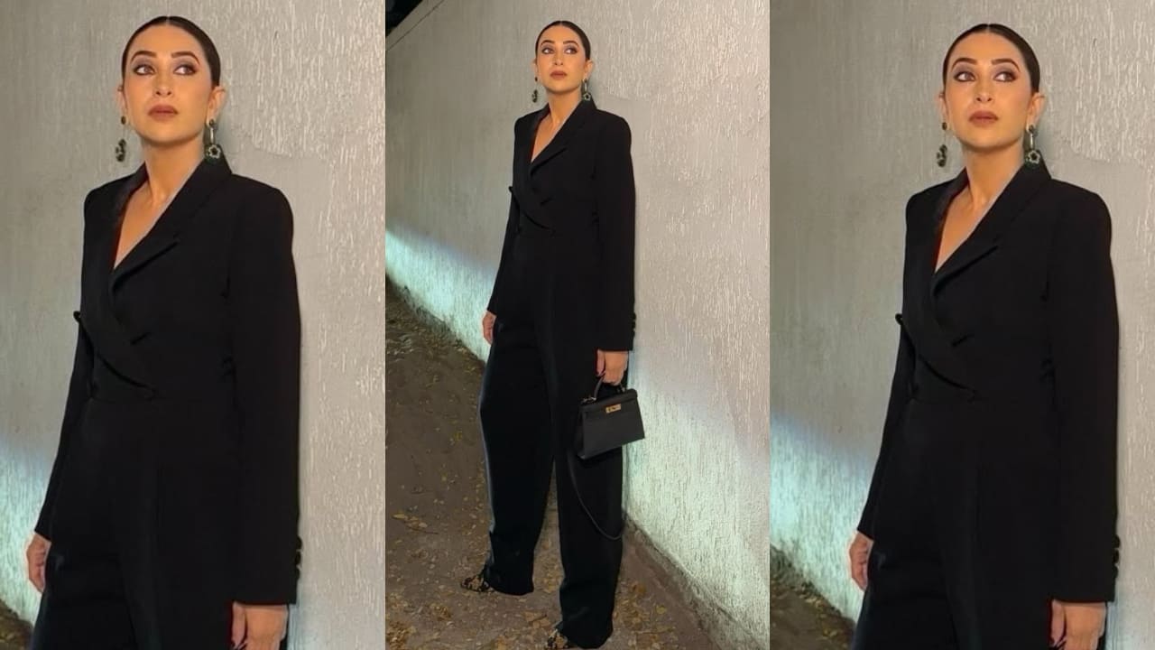 Karisma Kapoor looks bossy and bold in her tailored fit blazer jumpsuit styled perfectly with sleek hair bun