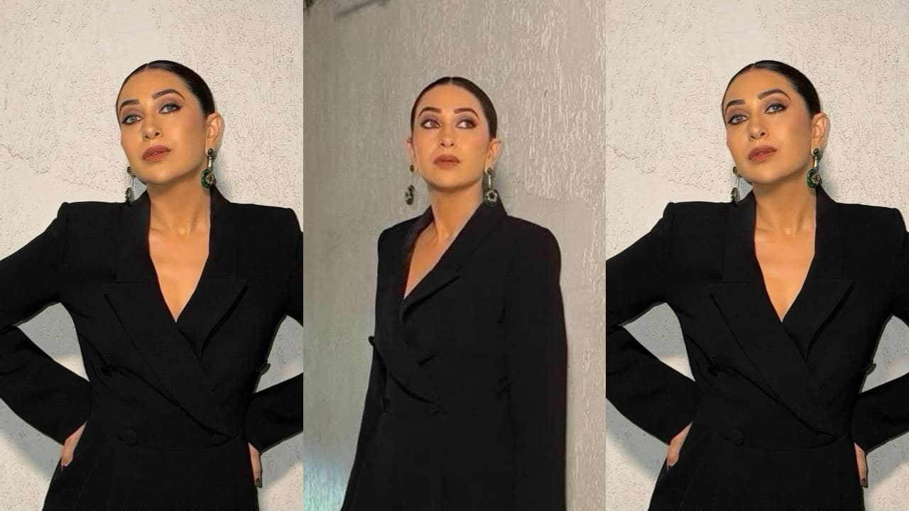 Karisma Kapoor looks bossy and bold in her tailored fit blazer jumpsuit styled perfectly with sleek hair bun