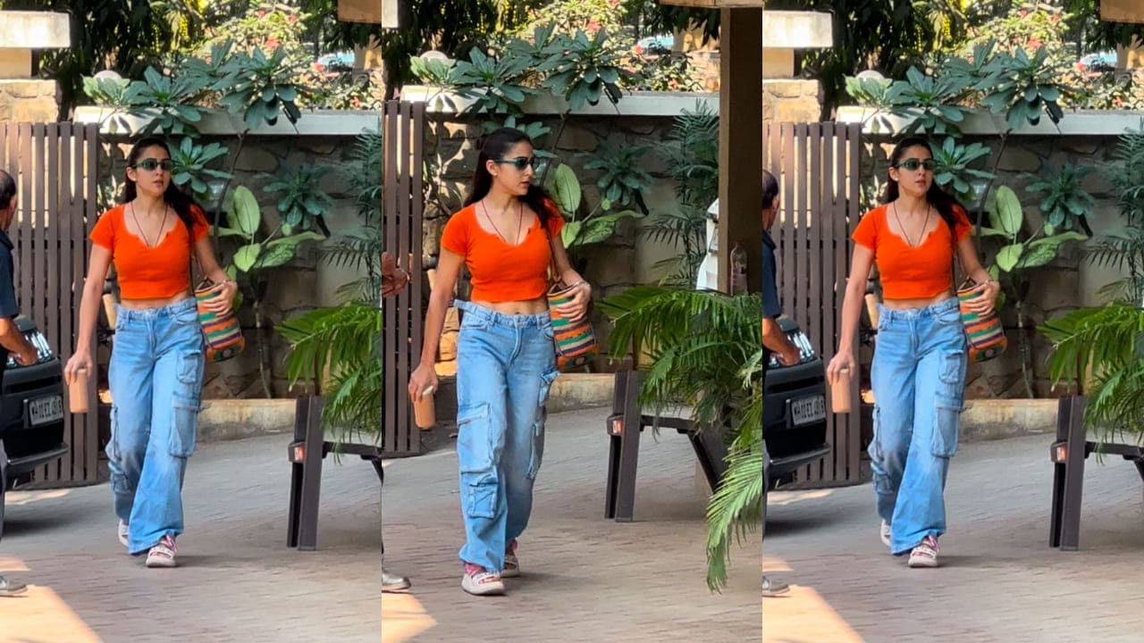  Sara Ali Khan mixes playful colors with practical style, pairing an orange crop top with trendy cargo jeans for a fresh look