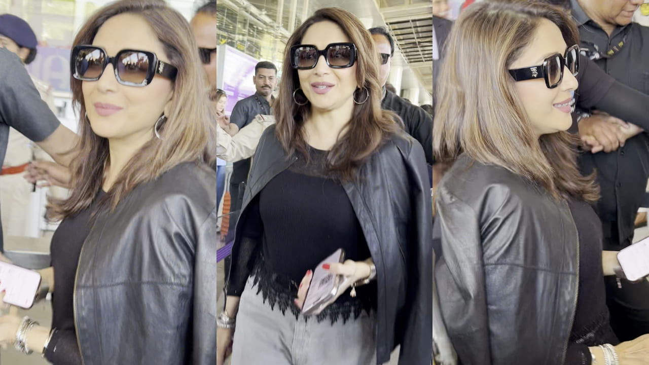 Madhuri Dixit adds posh touch to her leather-jacket airport ensemble with Louis Vuitton bag valued at Rs 1.77L. PC: Bablu