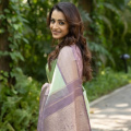 Trisha Krishnan in lavender and pista green Kanjivaram saree makes a perfect pastel combination for wedding guest outfit