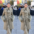 Kriti Sanon adds glamor to a muted look with a feathered trench coat and pants at the Burberry Show during London Fashion Week