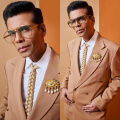 Yay or Nay? Karan Johar wears blonde braided hair tie and eye brooch, collectively costing Rs 3,45,790 with brown suit