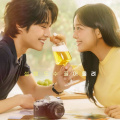 Brewing Love main poster: Kim Sejeong and Lee Jong Won exchange loving gaze over a glass of beer