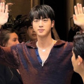 BTS' Jin makes debut appearance at Milan Fashion Week; spotted sitting beside Dakota Johnson, Nicola Coughlan