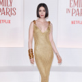 Emily in Paris star Lily Collins in Schiaparelli gold knit dress, priced at Rs 4,73,504 creates her own golden hour moment