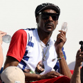 Snoop Dogg Wears Custom T-Shirts Featuring Olympians Simone Biles And Coco Gauff Amid Paris Olympics 2024 Appearance 