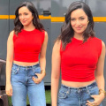 Shraddha Kapoor pairs sleeveless red crop top and wide-legged jeans with pumps for a radiant look