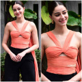 Ananya Panday serves the edgiest style statement in fiery orange top with front cuts and black draped pants