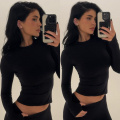 Kylie Jenner in a black top and pants shows she can dominate the fashion game, even with the most basic pieces