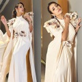 Malaika Arora’s ivory gown with 3d floral details prove that she needs no color to shine