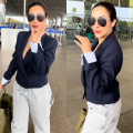 Malaika Arora adds power twist to her airport look ft. short blue blazer and denim pants with a Rs 6.69 lakh Bottega Veneta bag 